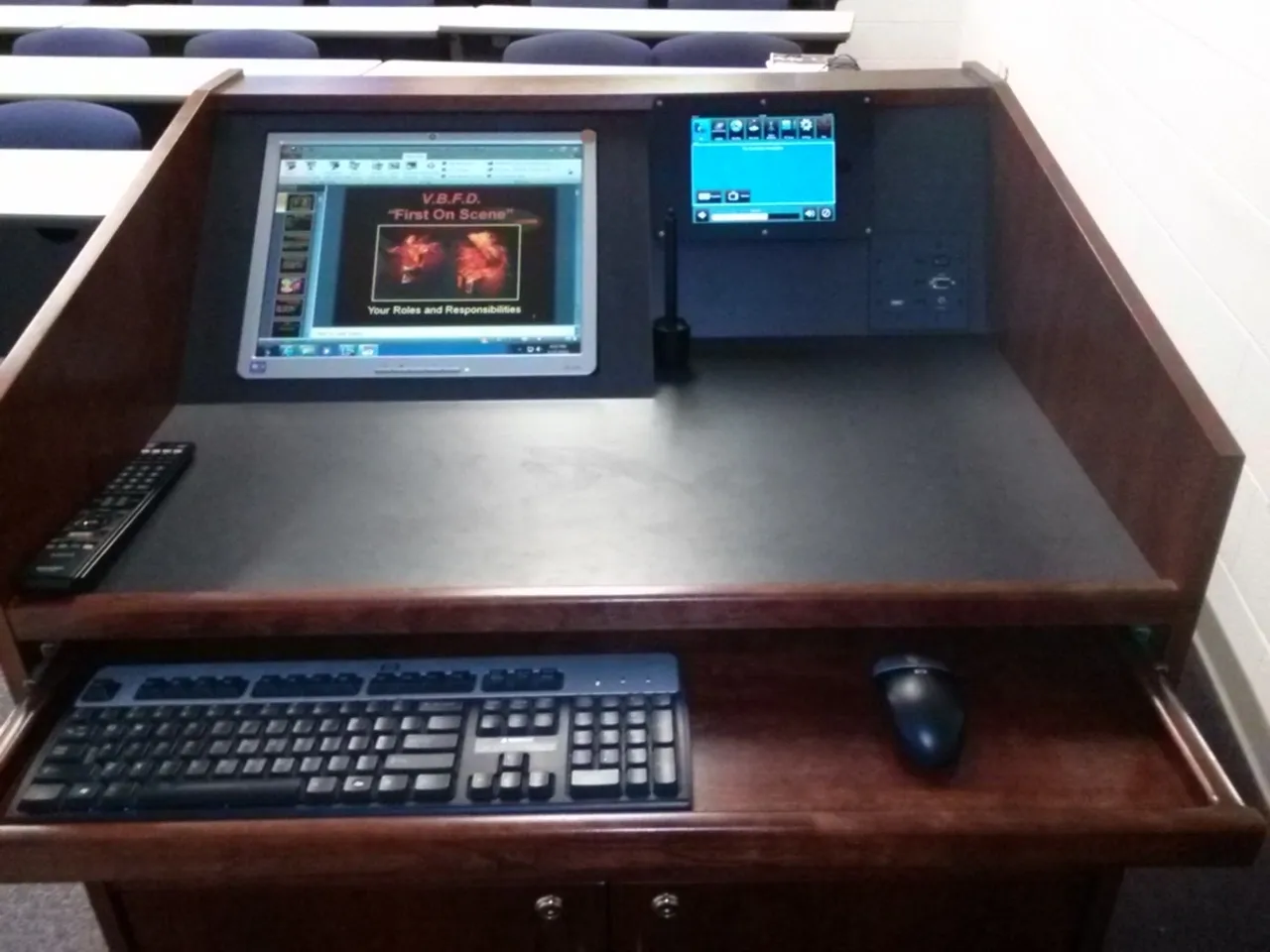 A computer desk with a keyboard and mouse.