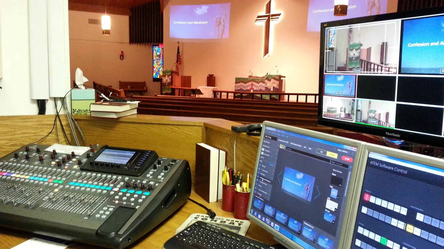 A church with a large screen tv and computer.