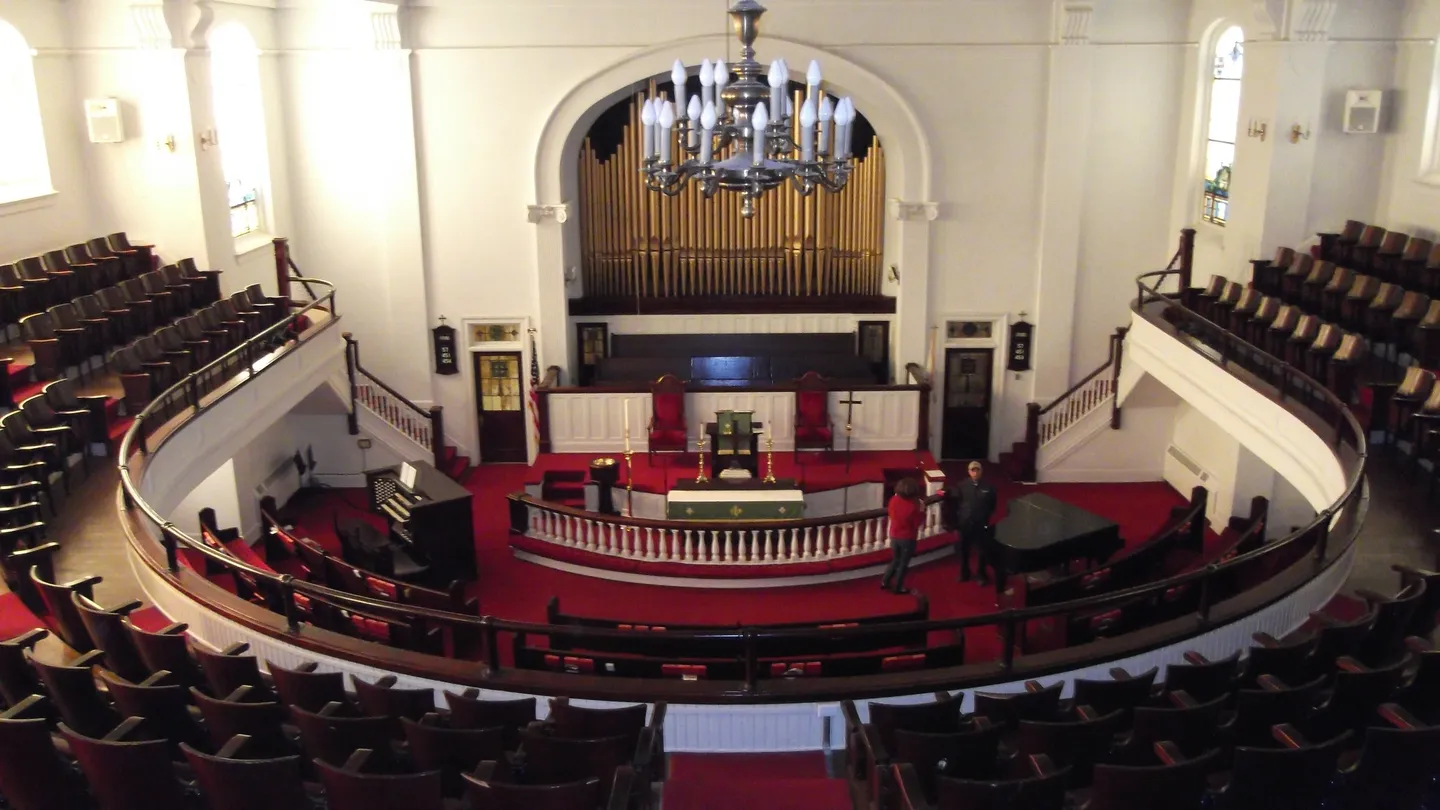 A large church with many chairs and a stage